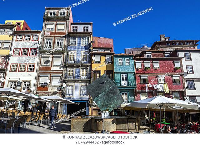 Tenement houses and Cubo da Ribeira modern sculpture by Jose Rodrigues on Ribeira Square in Porto city, second largest city in Portugal