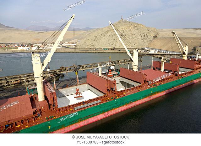 Cargo ship being unloaded at the port of Salaverry, Trujillo, Peru