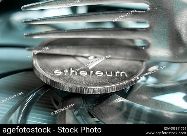 Macro photo of Ethereum cryptocurreny fork concept with reflection, hard fork