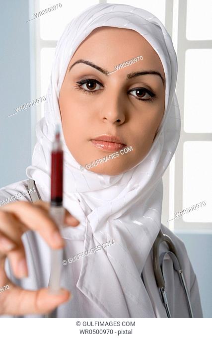 Young doctor holding up-up