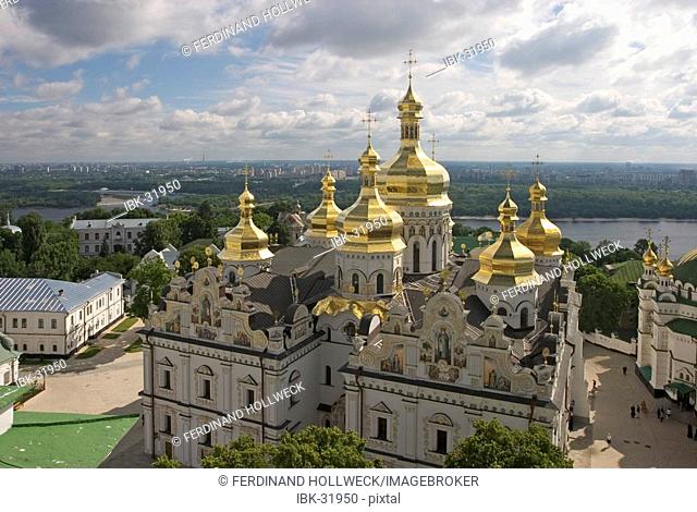 Ukraine Kiev the monastery of cave Kyjevo Pecers'ka Lavra view to Uspens'kyj Cathedral with 7 golden domes crosses blue sky river Dnepr at background 2004