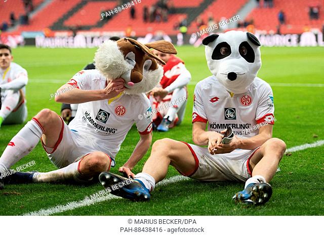 Mainz's Fabian Frei (L) and Gaetan Bussmann wear carnival masks after the German Bundesliga soccer match between Bayer Leverkusen - FSV Mainz 05 in the BayArena...