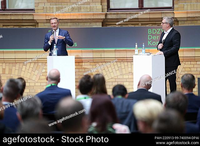 13 September 2022, Berlin: Christian Lindner (l, FDP), Federal Minister of Finance, is interviewed by Thomas Lindner, Chairman of the Management Board of the...