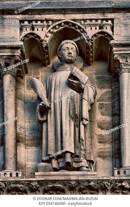 Notre Dame de Paris Cathedral Gothic style. Architectural details, Holy Stefan on the arch of judgment