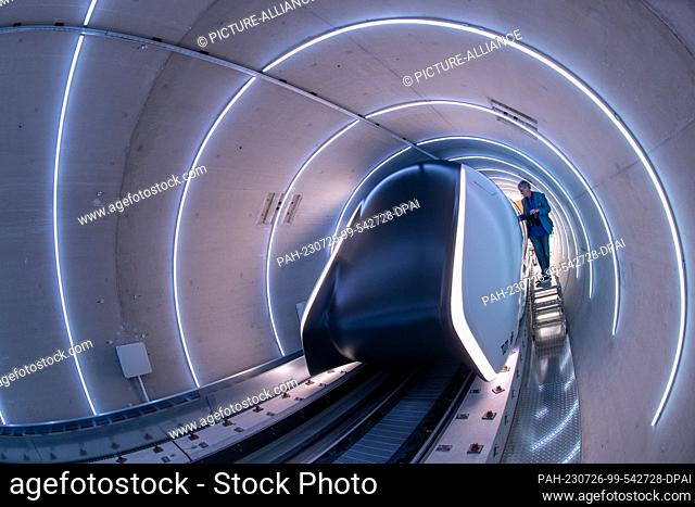 26 July 2023, Bavaria, Ottobrunn: The Hyperloop test track tube with its transport cabin is open for viewing before the opening begins
