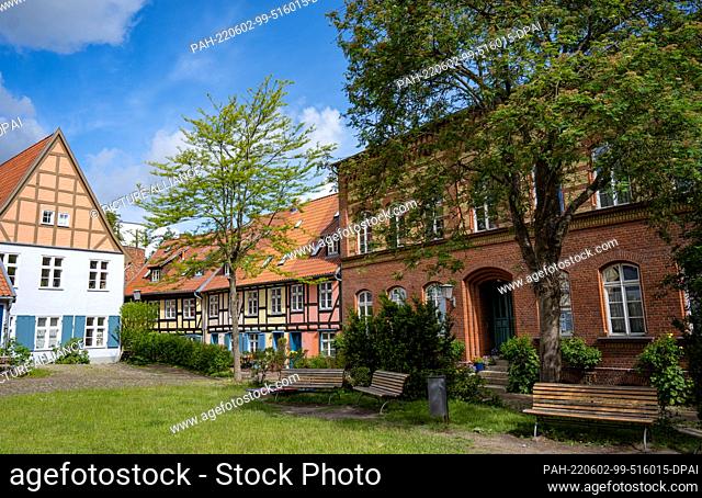 31 May 2022, Mecklenburg-Western Pomerania, Stralsund: Half-timbered houses in the monastery courtyard of the former Franciscan monastery of St