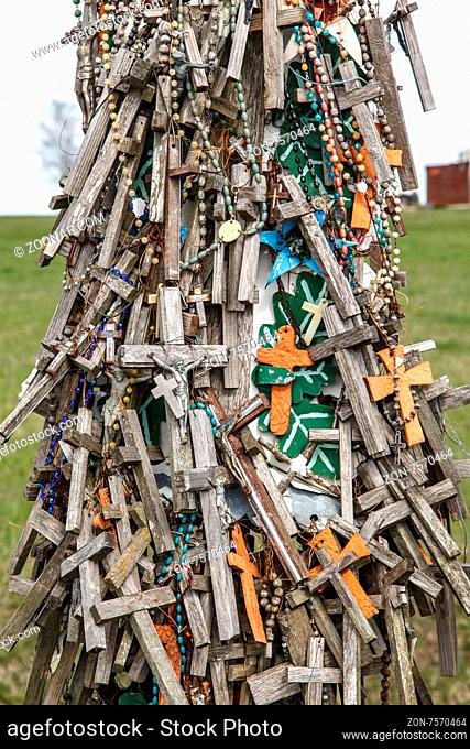 SIAULIAI, LITHUANIA - MAY 1, 2015 : Close up front view of hill of crosses with over four hundred thousand crosses and crucifix