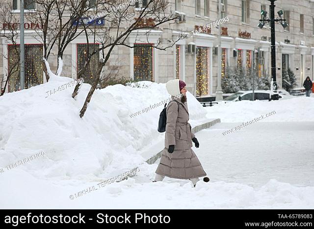 RUSSIA, MOSCOW - DECEMBER 15, 2023: A woman walks in central Moscow after a snowfall. Mikhail Tereshchenko/TASS