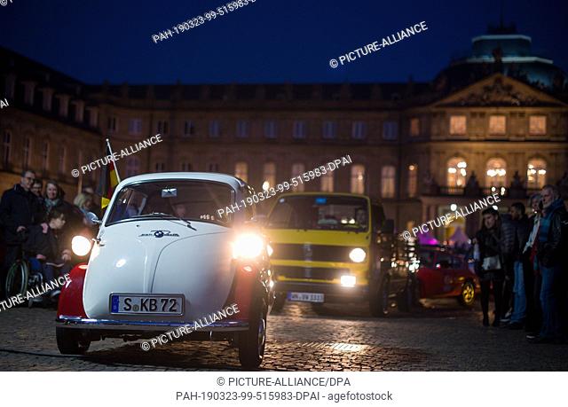 23 March 2019, Baden-Wuerttemberg, Stuttgart: During the 20th Long Night of the Museums an Iso Isetta drives along the Rolling Museum in front of the new castle