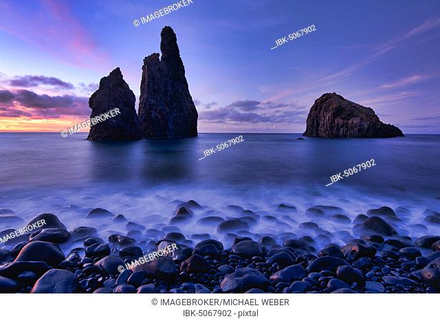 Volcanic rock formation Ilheus da Rib, steep coast of Ribeira de Janela, also Ribeira da Janela, blue hour, sunset, Porto Moniz, island Madeira, Portugal