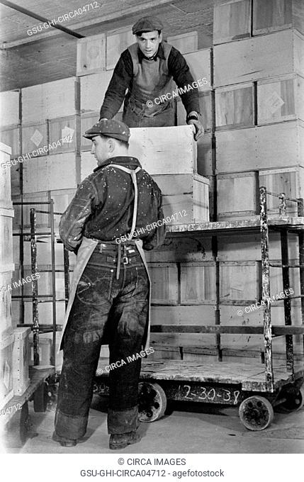Two Workers Storing Crates of Eggs in Cold Storage Warehouse, Jersey City, New Jersey, USA, Arthur Rothstein for Farm Security Administration, January 1939