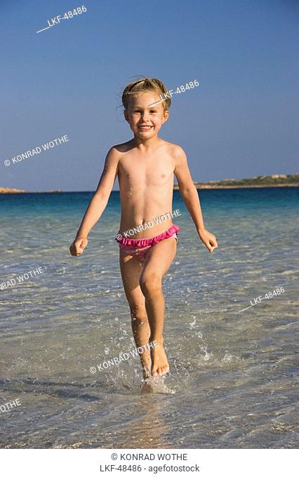 child at Cala Brandinchi Beach, eastcoast, Sardinia, Italy