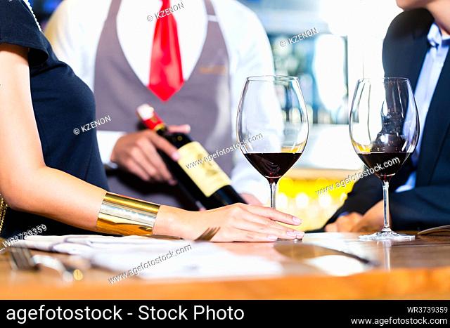 Couple tasting red wine in wine shope