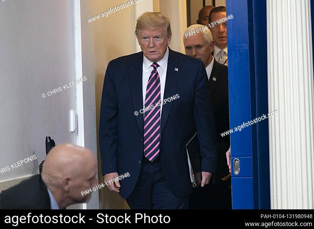 United States President Donald J. Trump, followed by US Vice President Mike Pence, arrives for a news briefing with members of the Coronavirus Task Force at the...