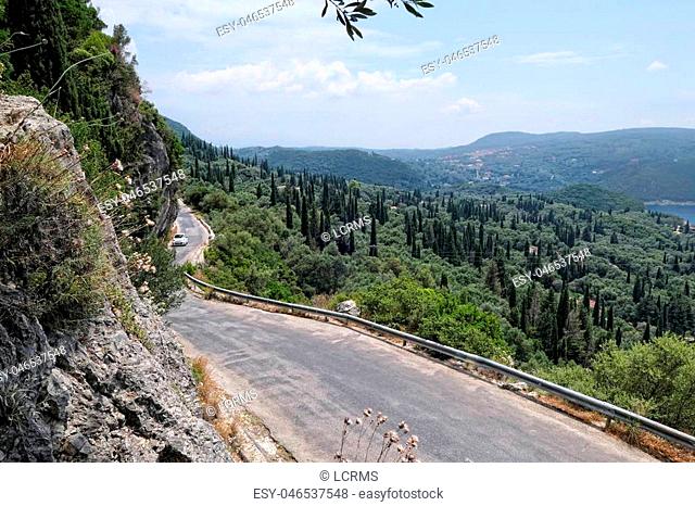 Corfu island (Greece) mountain road over Paleokastritsa towards Lakones. View into valley and bay of Liapades