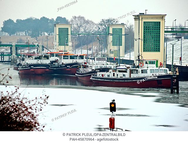 Six ice-breakers lie at the watergate in Hohensaaten, Germany, 28 January 2014. They will be employed soon to free frozen German-Polish border river Oder from...