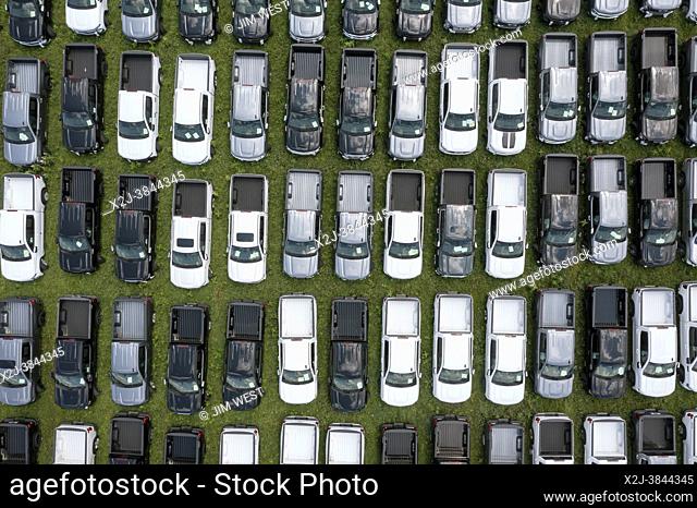 Fort Wayne, Indiana - New GMC and Chevrolet pickup trucks are parked, unable to be sold, because of the global shortage of semiconductor chips