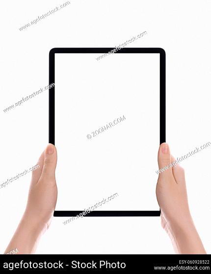 Hands holding a tablet computer with white screen. Woman hands showing empty screen of modern digital tablet. Hand holding tablet pc isolated on white...