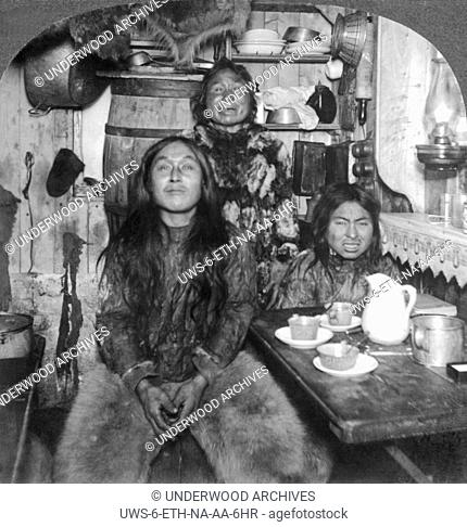 Fort Magnesia, Cape Sabine, Ellesmere Land, Canada: c. 1900.An Eskimo family poses in its home