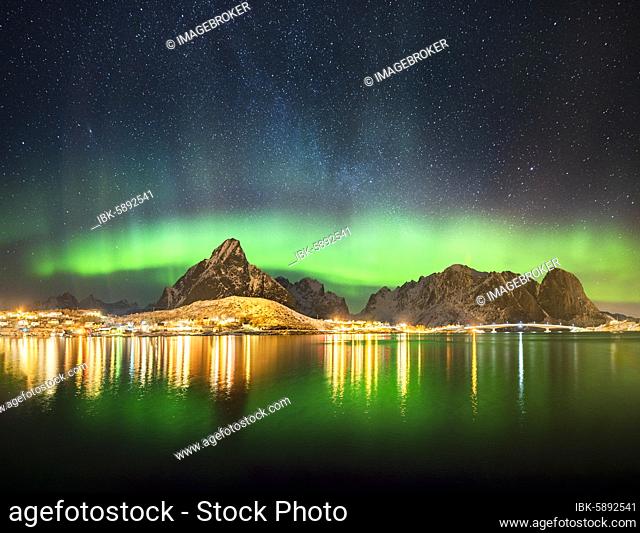 Northern lights at the fjord above the fishing village Reine, Moskenes, Nordland, Lofoten, Norway, Europe