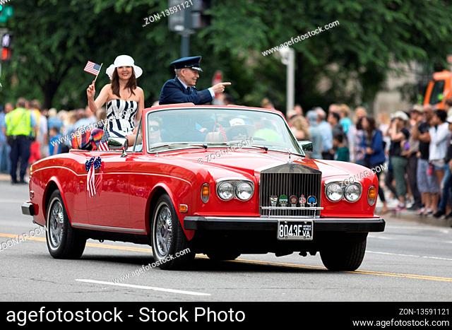 Washington, D.C., USA - May 28, 2018: The National Memorial Day Parade, Air Force Member and his wife going down constitution avenue on a rolls royce