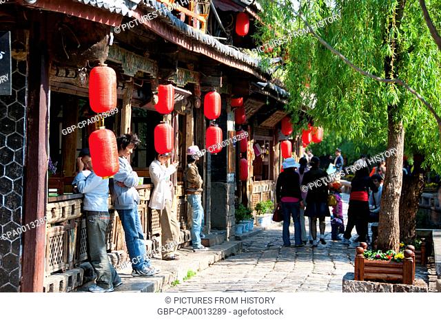 China: Cafes and restaurants line Xinhua Jie (Xinhua Street), Lijiang Old Town, Yunnan Province