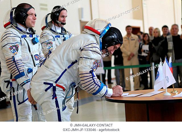 At the Gagarin Cosmonaut Training Center in Star City, Russia, Expedition 3738 Flight Engineer Michael Hopkins of NASA signs in for a round of qualification...