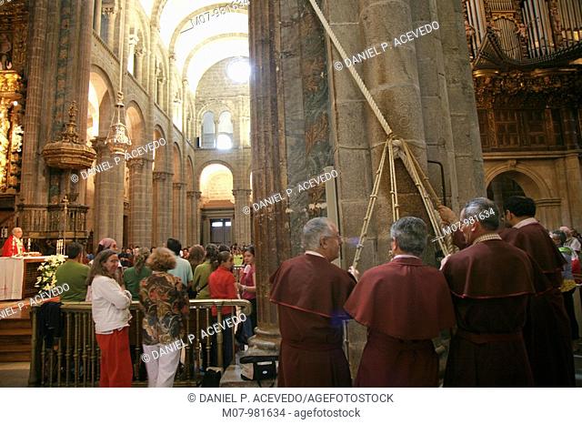 Priests doing the Botafumeiro inside Santiago Cathedral, Galcia, Spain, Europe
