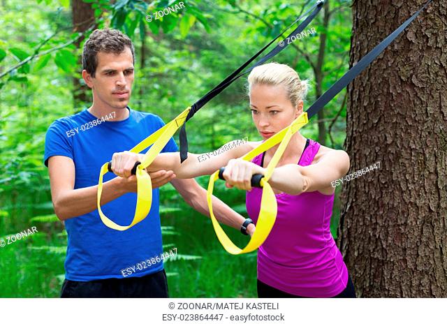 Training with fitness straps outdoors