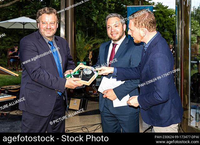 24 June 2023, Saxony, Bad Muskau: Michael Kretschmer (CDU) (r-l), Prime Minister of Saxony and Sebastian Hecht, Head of Office in the Saxon Ministry of Finance...