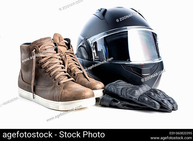 Safety motorcycle accessories. Leather gloves, helmet and shoes isolated on a white background