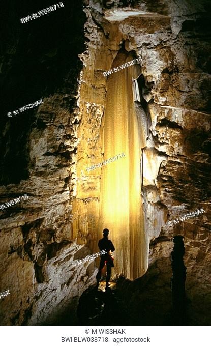 cave, Baume des Cretes, caver and flowstone cascade, France, Doubs