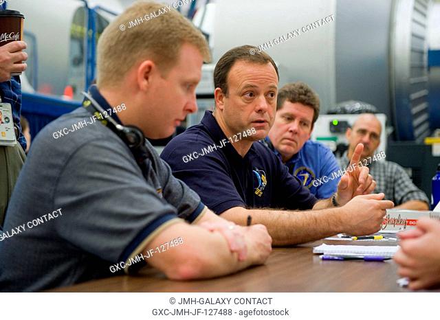 NASA astronaut Ron Garan (center), Expedition 2728 flight engineer, participates in an emergency scenarios training session in the Space Vehicle Mock-up...