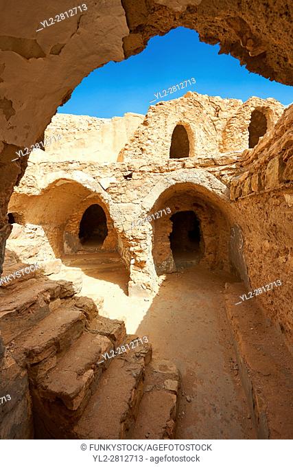 The northern Sahara ghorfa storage graneries of the traditional Berber mud brick fortified Ksar of Hedada or Hadada, near Tetouin, Tunisia