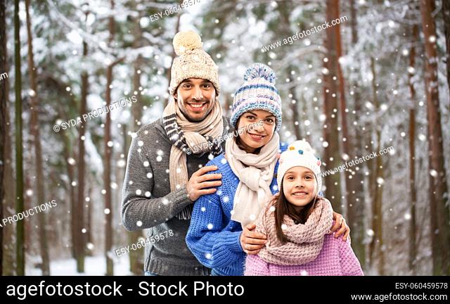 happy family over winter forest background