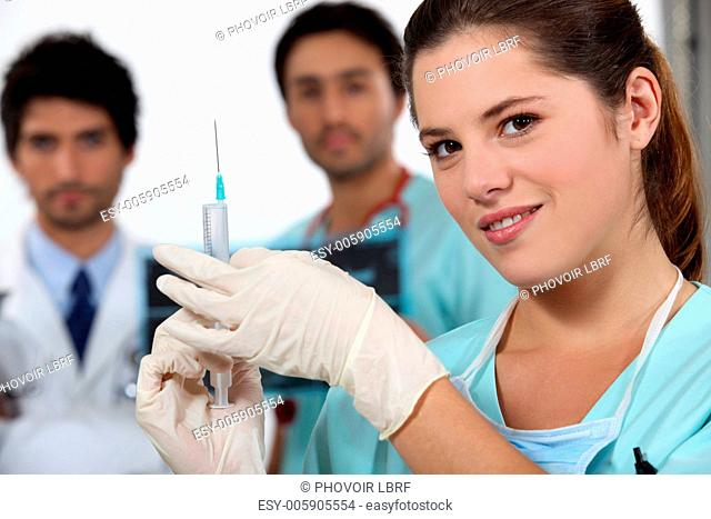 Nurse holding needle