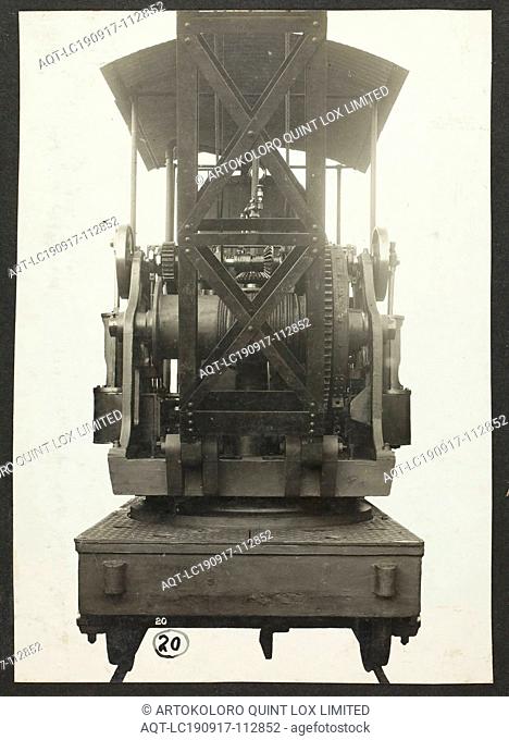 Photograph - A.T. Harman & Sons, Front View of a Rail-Mounted Excavator, circa 1923, One of three black and white photographs attached to an album page
