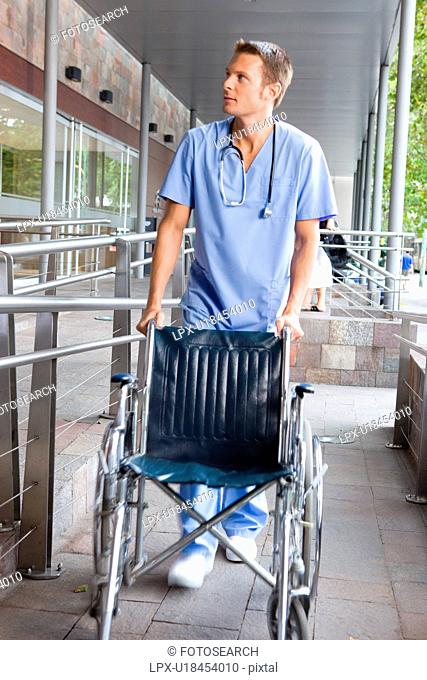Male nurse with a wheelchair