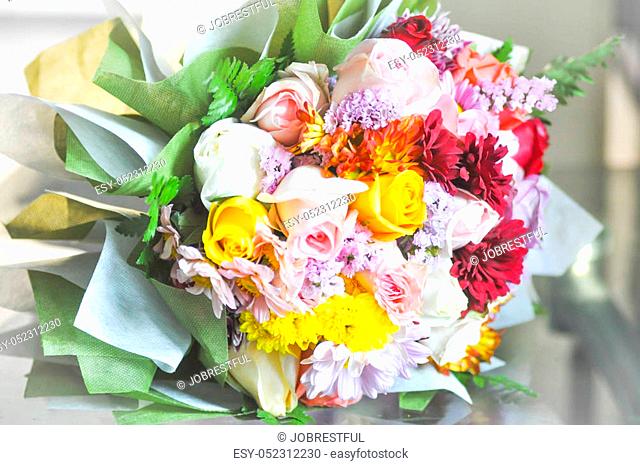 bouquet of white, pink and yellow rose flowers on the table