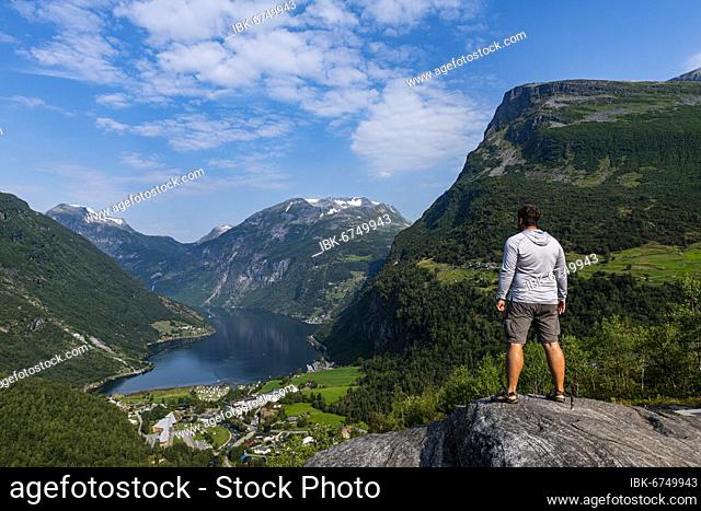 Man overlooking Geirangerfjord, Sunmore, Norway, Europe