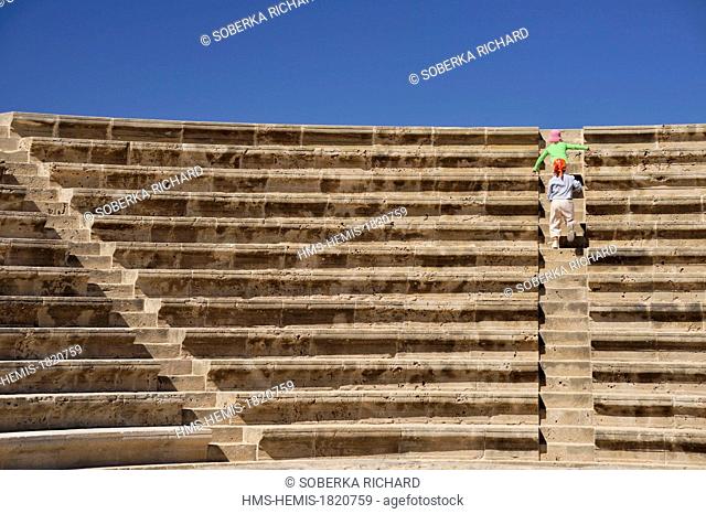 Cyprus, Paphos District, Paphos, Paphos Archaeological Site, Roman Odeon, two children climbing the steps