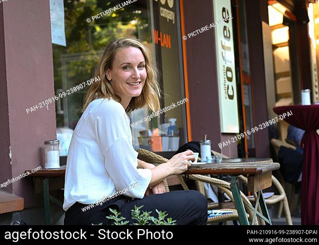 10 September 2021, Berlin: Actress Christina Athenstädt sits in a cafe during a walk in Berlin Moabit. Christina Athenstädt plays the blind lawyer Romy Heiland...