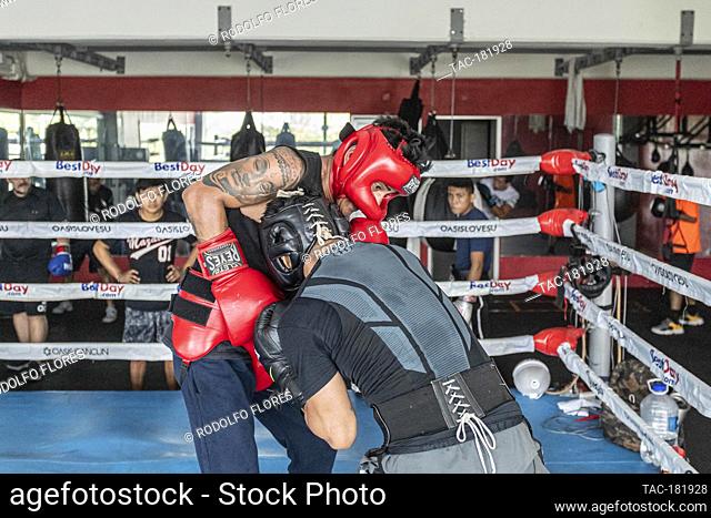 CANCUN, MEXICO - OCTOBER 20: Alexis Bastar (L) and Joselito Velazquez (R), boxing fighters training in the ring to prepares their bodies and improve their...