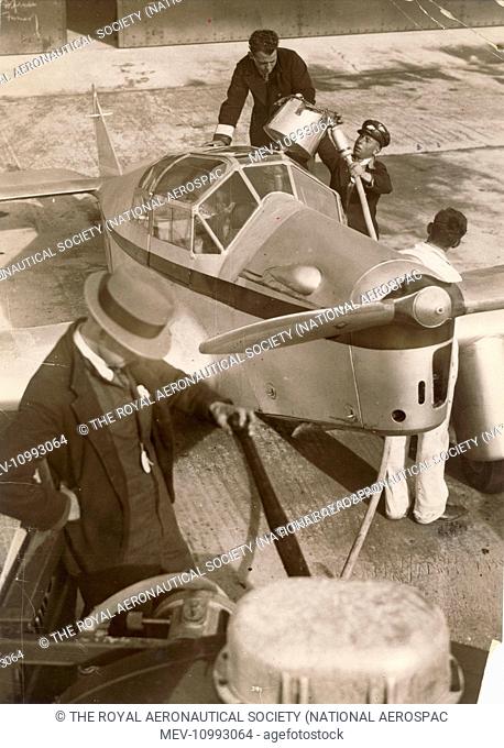 Miles M3 Falcon, G-ACTM, is refuelled at Mildenhall prior to the MacRobertson England to Australia race, October 1934