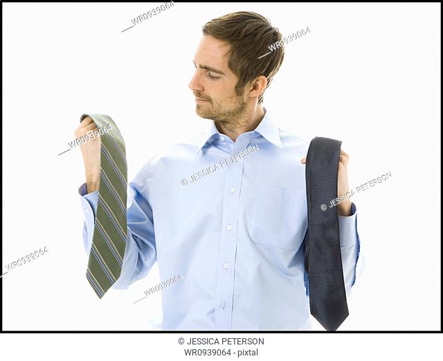 man choosing a tie