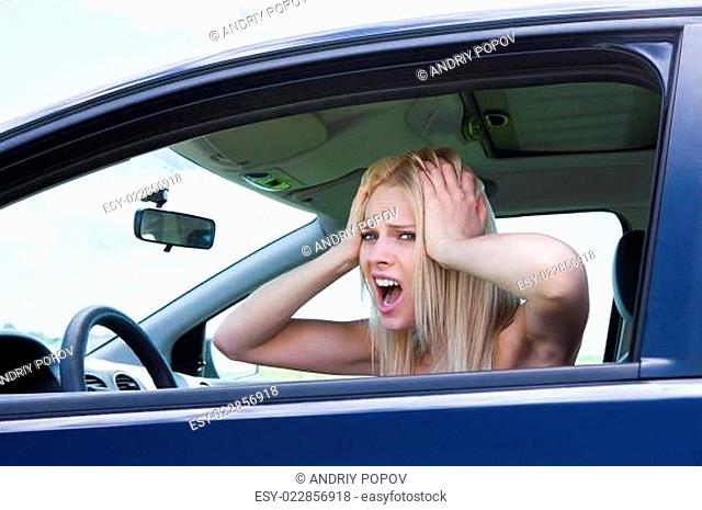 Frustrated Woman Screaming Sitting In Car