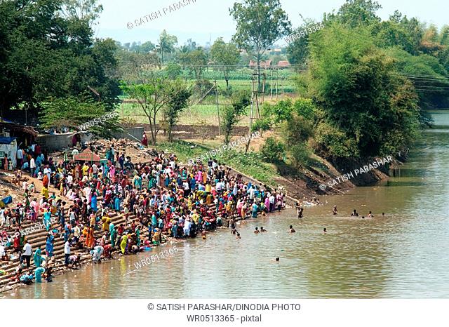 People taking bath in ghataprabha river at hukkeri , Belgaum , Karnataka , India