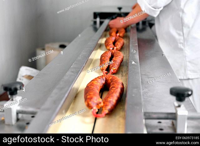 Sausages. Packing line of sausages. Industrial manufacture of sausage products. High quality photo