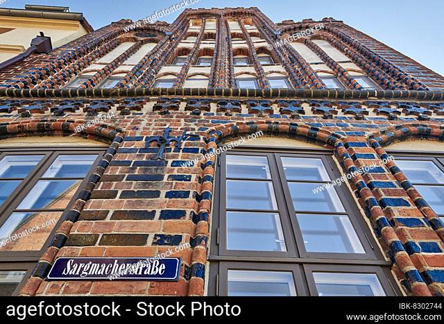 Residence and administration building of the archdeacon, 1407, 1408, north gable, street sign Sargmacherstraße, Wismar, Mecklenburg-Western Pomerania, Germany