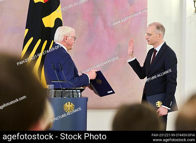 21 December 2023, Berlin: Frank-Walter Steinmeier (l), Federal President, swears in Holger Wöckel, judge of the Federal Constitutional Court, at Bellevue Palace
